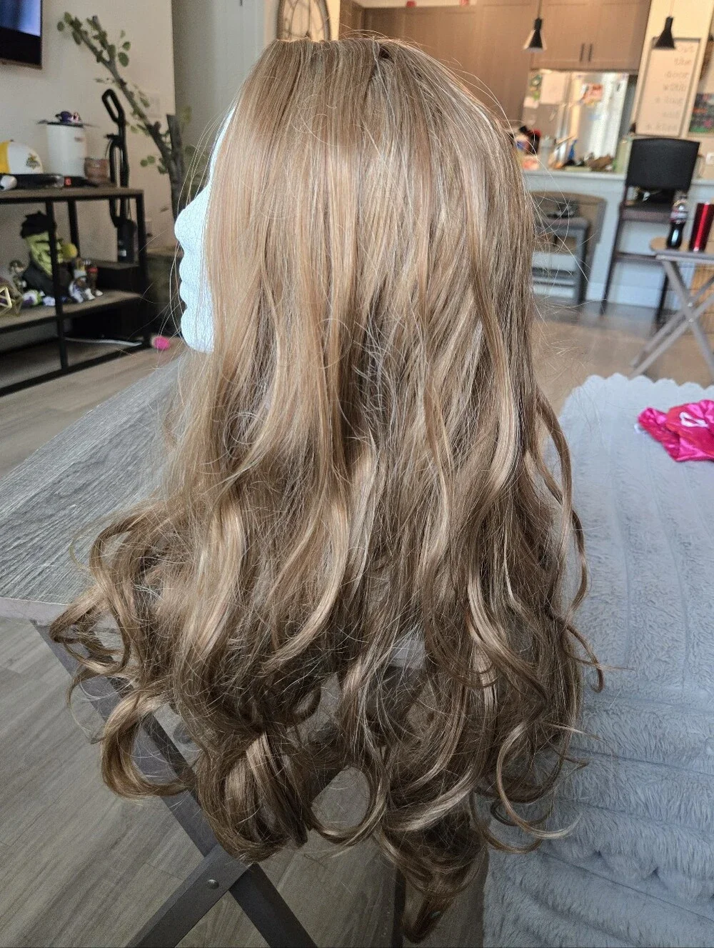 Women's long, wavy synthetic wig in a light brown/honey blonde Light Curls